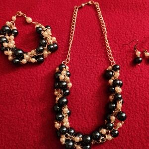 Blue and white 3 piece twisted pearl set . Necklace bracelet and earrings .